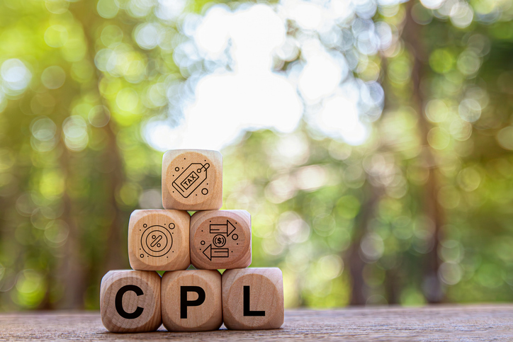 wooden dice with symbols and the letters C P L
